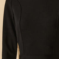 Abito longuette nero con collo dolcevita e fondo in organza con lattice