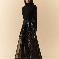 Gonna longuette in organza nera con spalmature in lattice